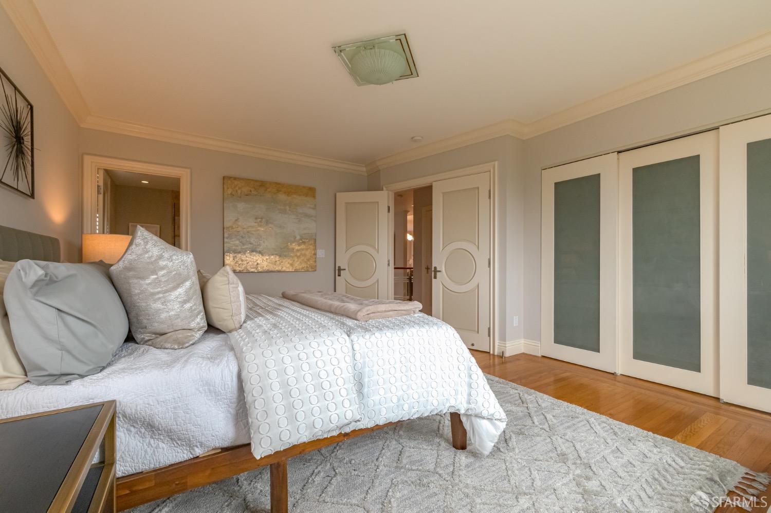 155 Upland Drive San Francisco, CA 94127 - Photo 14 of 43 a bedroom with a bed and wooden floor