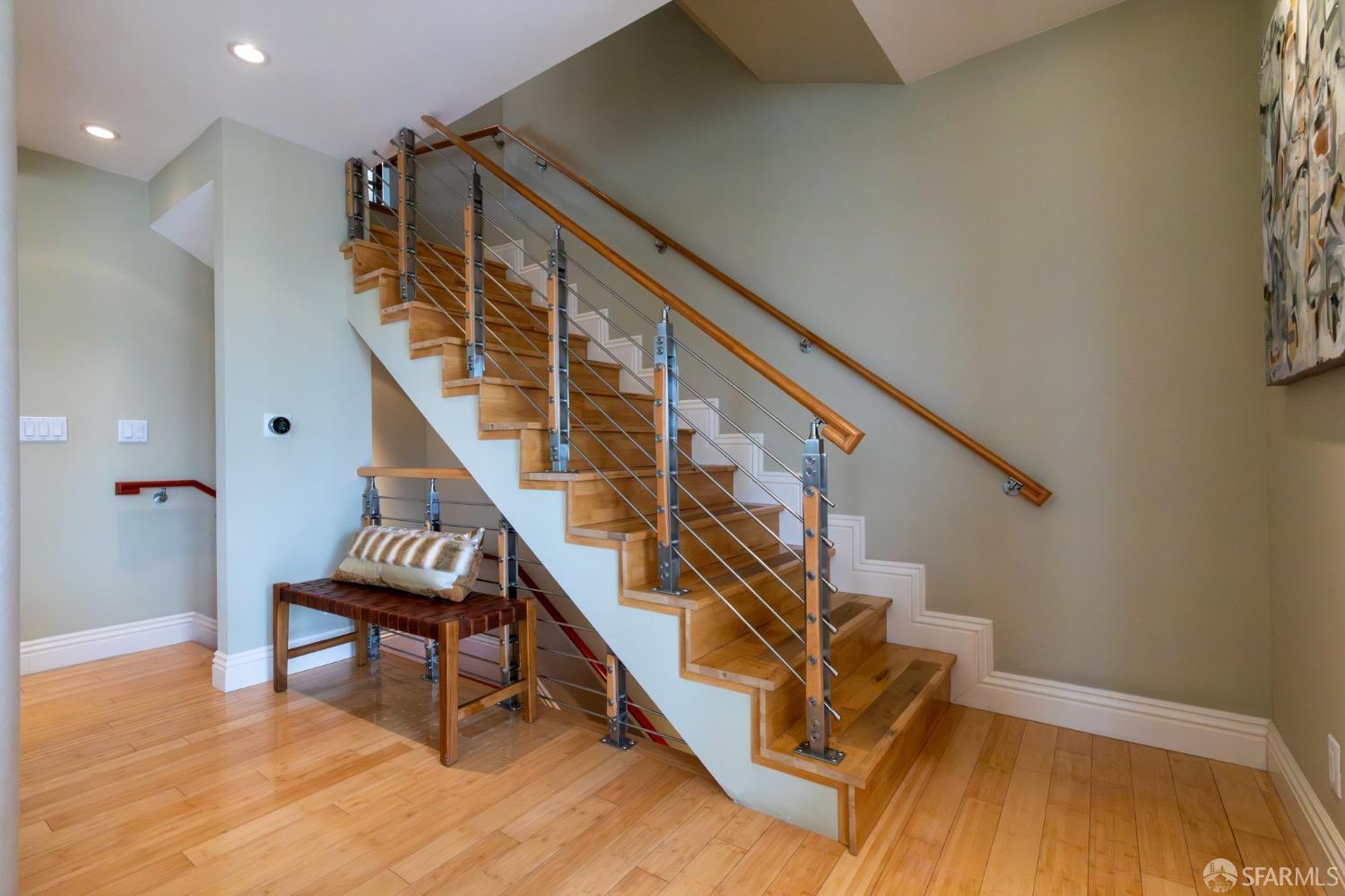 155 Upland Drive San Francisco, CA 94127 - Photo 19 of 43 a living room with stairs and a wooden floor