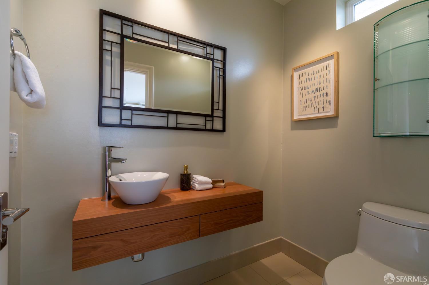 155 Upland Drive San Francisco, CA 94127 - Photo 23 of 43 a bathroom with a toilet a sink and mirror