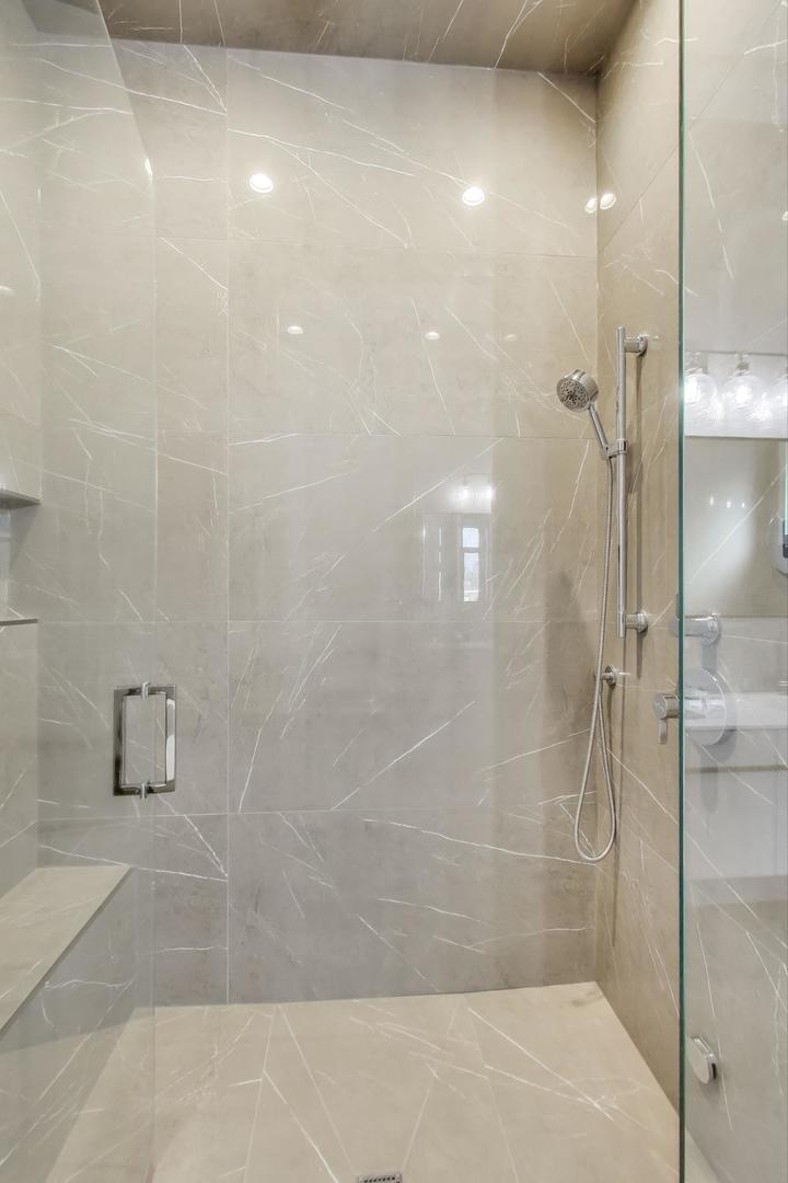 2405 West Iowa Street, Unit 405 Chicago, IL 60622 - Photo 11 of 35 a bathroom with a shower