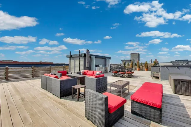 a view of a terrace with seating area and furniture