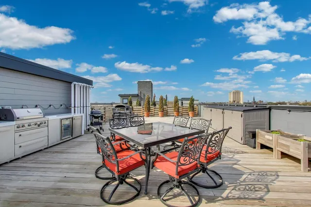 a dining area with furniture and wooden floor