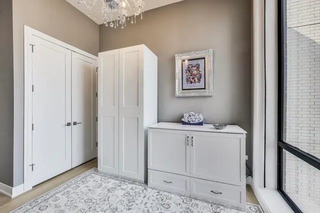 a view of cabinets with chandelier