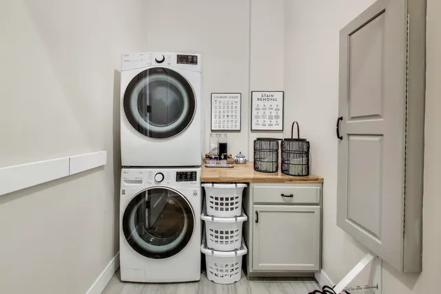 a utility room with sink dryer and washer