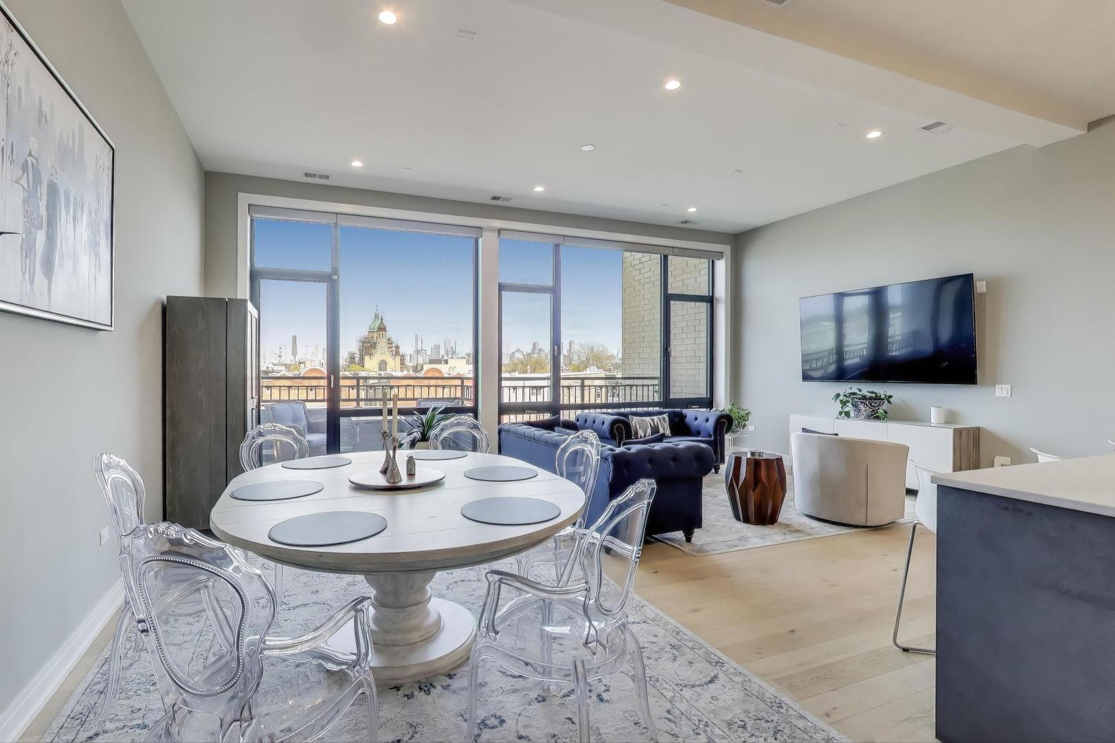 2405 West Iowa Street, Unit 405 Chicago, IL 60622 - Photo 5 of 35 a living room with furniture and a flat screen tv