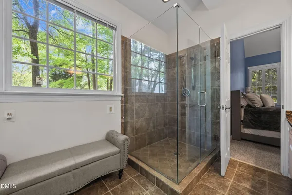 a bathroom with a shower and a sink