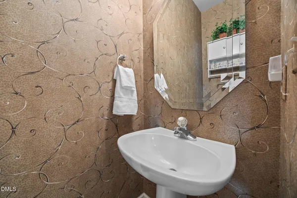 a bathroom with a sink and mirror