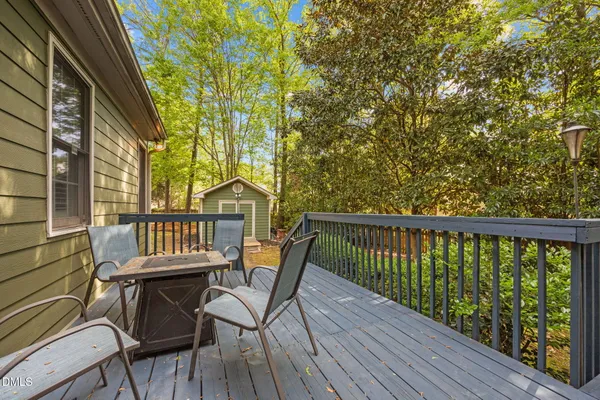 a view of a chairs on the roof deck