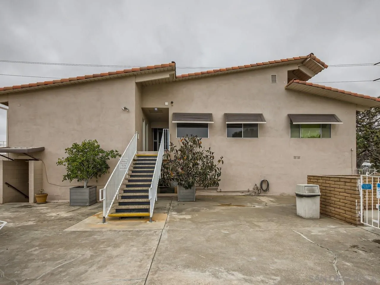 104 Havenview Lane Oceanside, CA 92056 - Photo 13 of 16 a view of a house with more windows and stairs