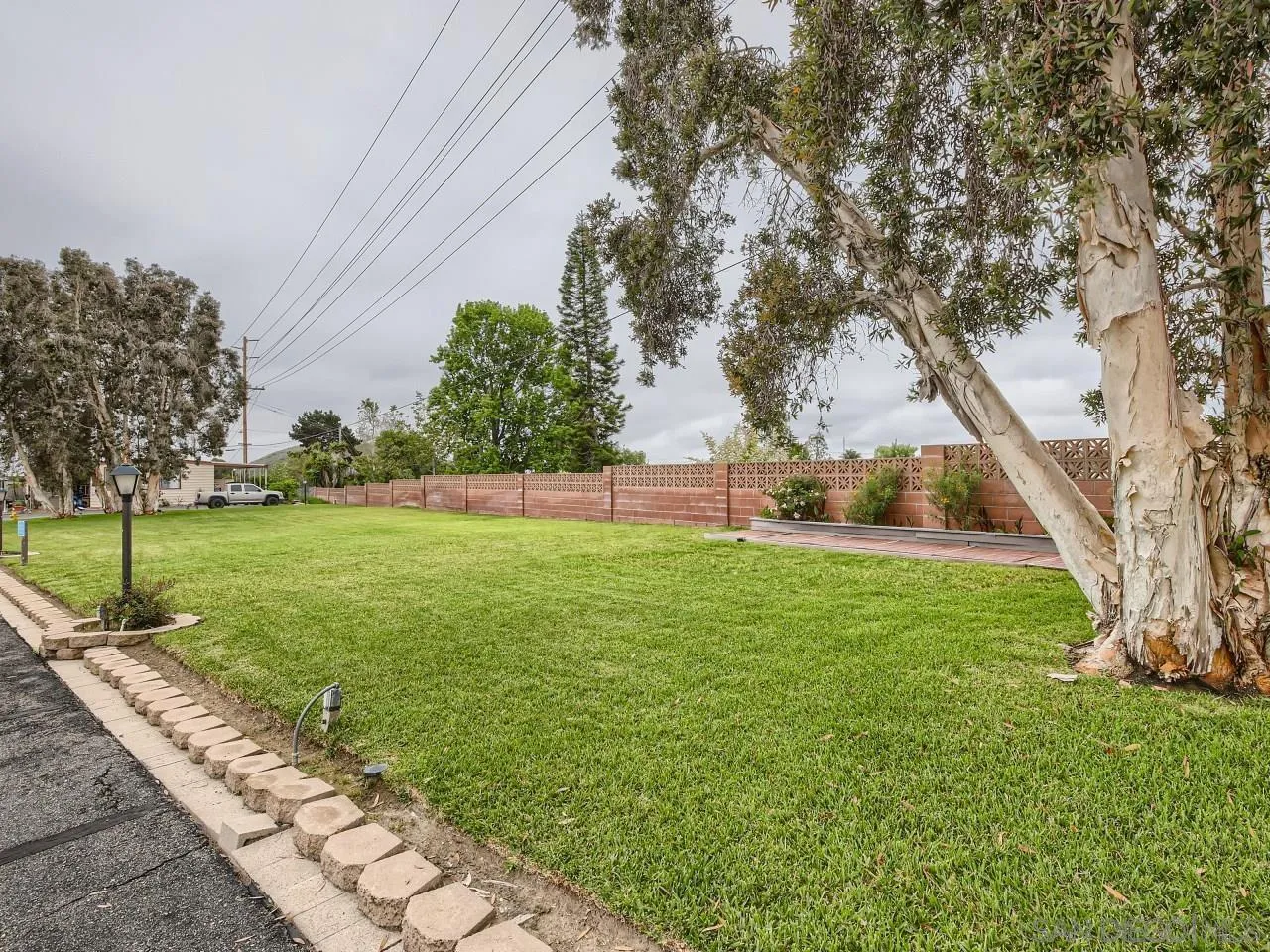 104 Havenview Lane Oceanside, CA 92056 - Photo 14 of 16 a view of yard with grass and trees
