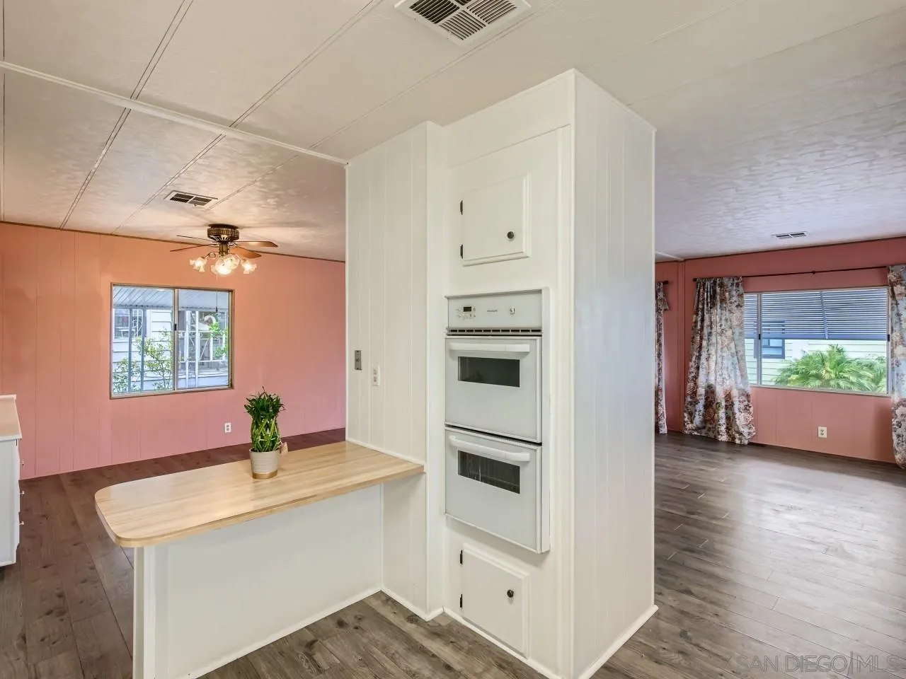 104 Havenview Lane Oceanside, CA 92056 - Photo 3 of 16 a kitchen with stainless steel appliances a sink and a stove