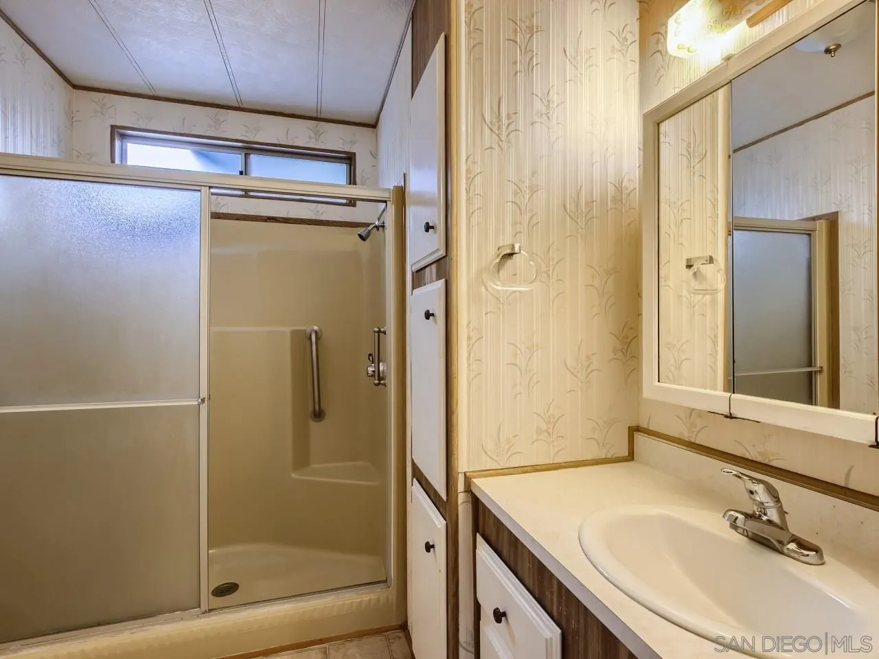 104 Havenview Lane Oceanside, CA 92056 - Photo 5 of 16 a bathroom with a sink and a mirror