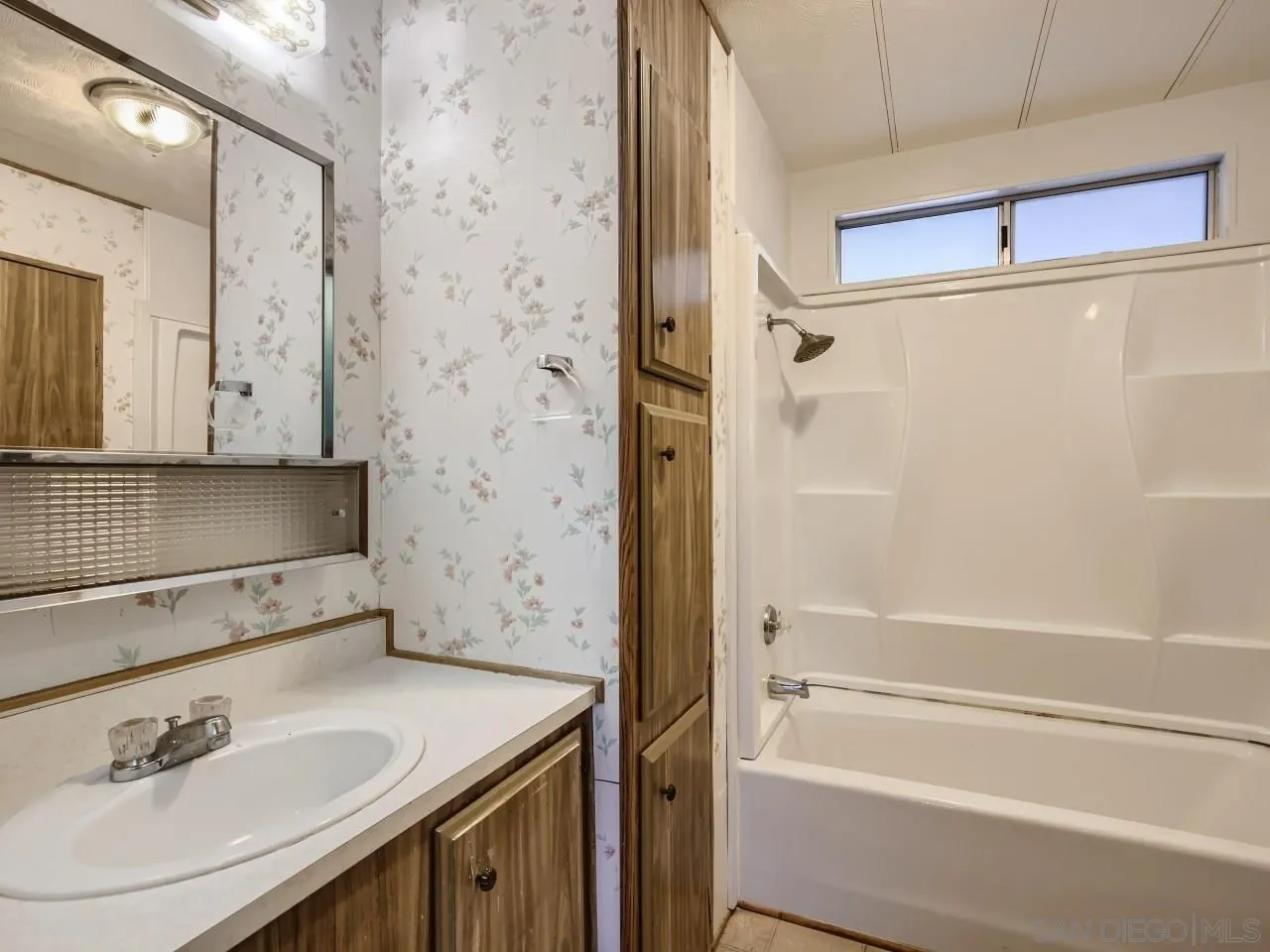 104 Havenview Lane Oceanside, CA 92056 - Photo 7 of 16 a bathroom with a granite countertop sink a toilet and shower
