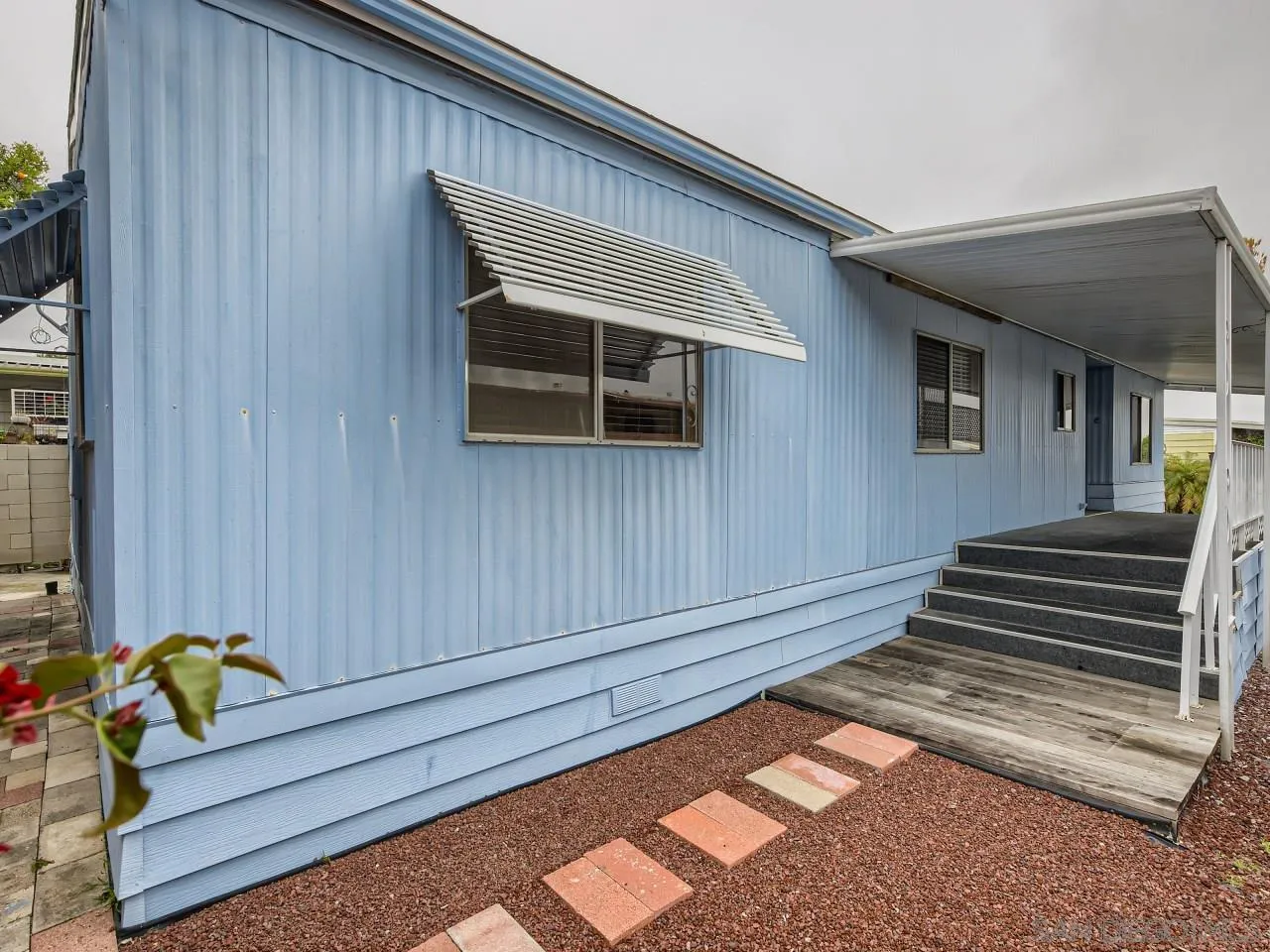 104 Havenview Lane Oceanside, CA 92056 - Photo 10 of 16 a backyard of a house with wooden table and chairs