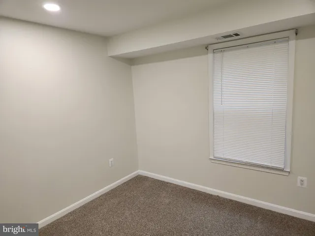 a bathroom with a toilet and a bathtub