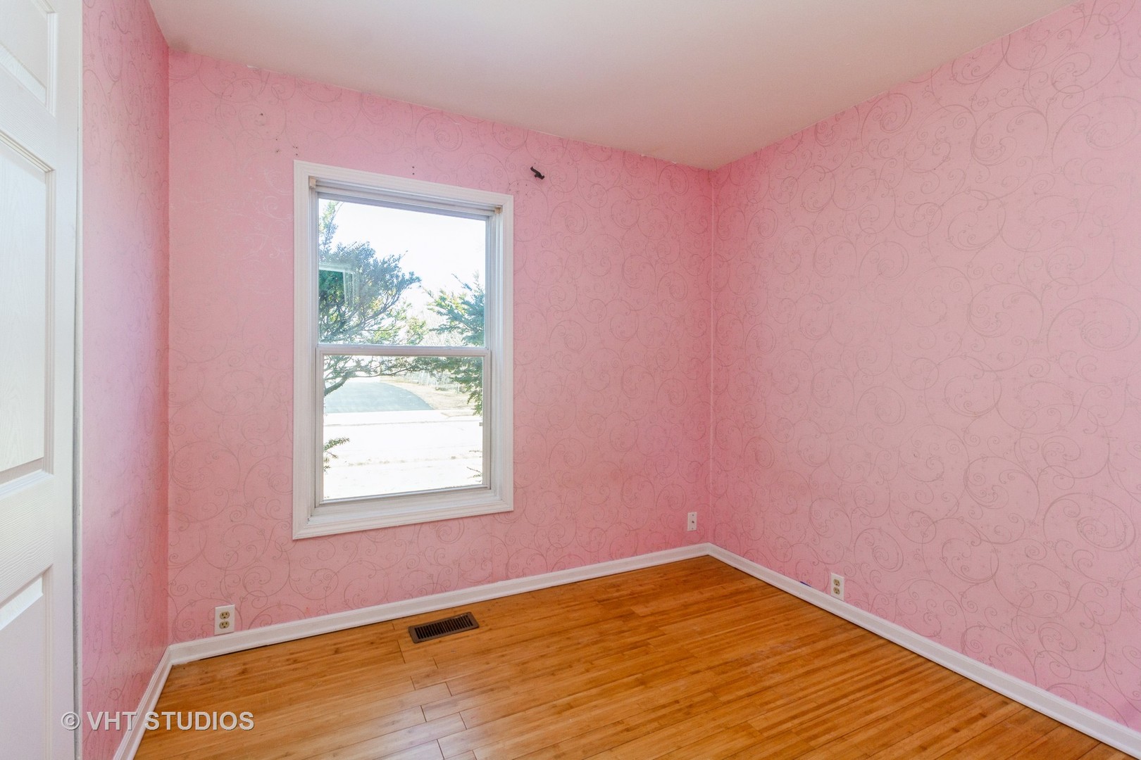 207 Haller Avenue Romeoville, IL 60446 - Photo 3 of 10 a view of empty room with wooden floor and fan