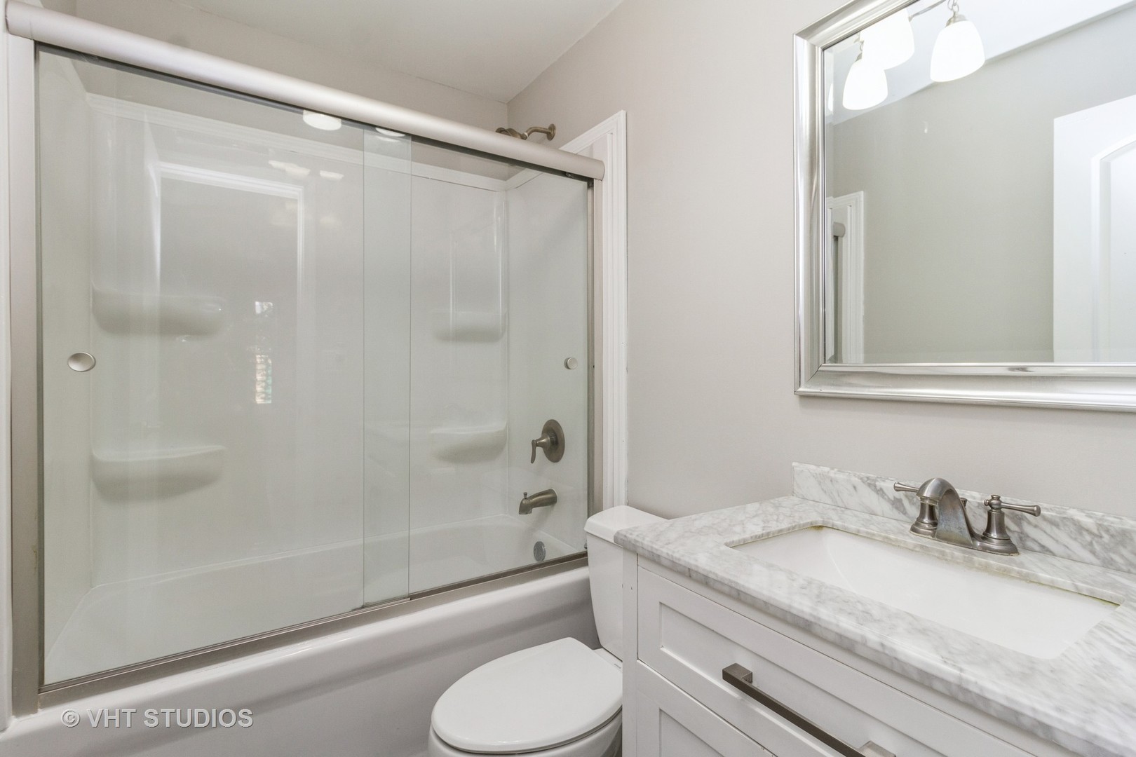 207 Haller Avenue Romeoville, IL 60446 - Photo 6 of 10 a bathroom with a granite countertop sink toilet and shower