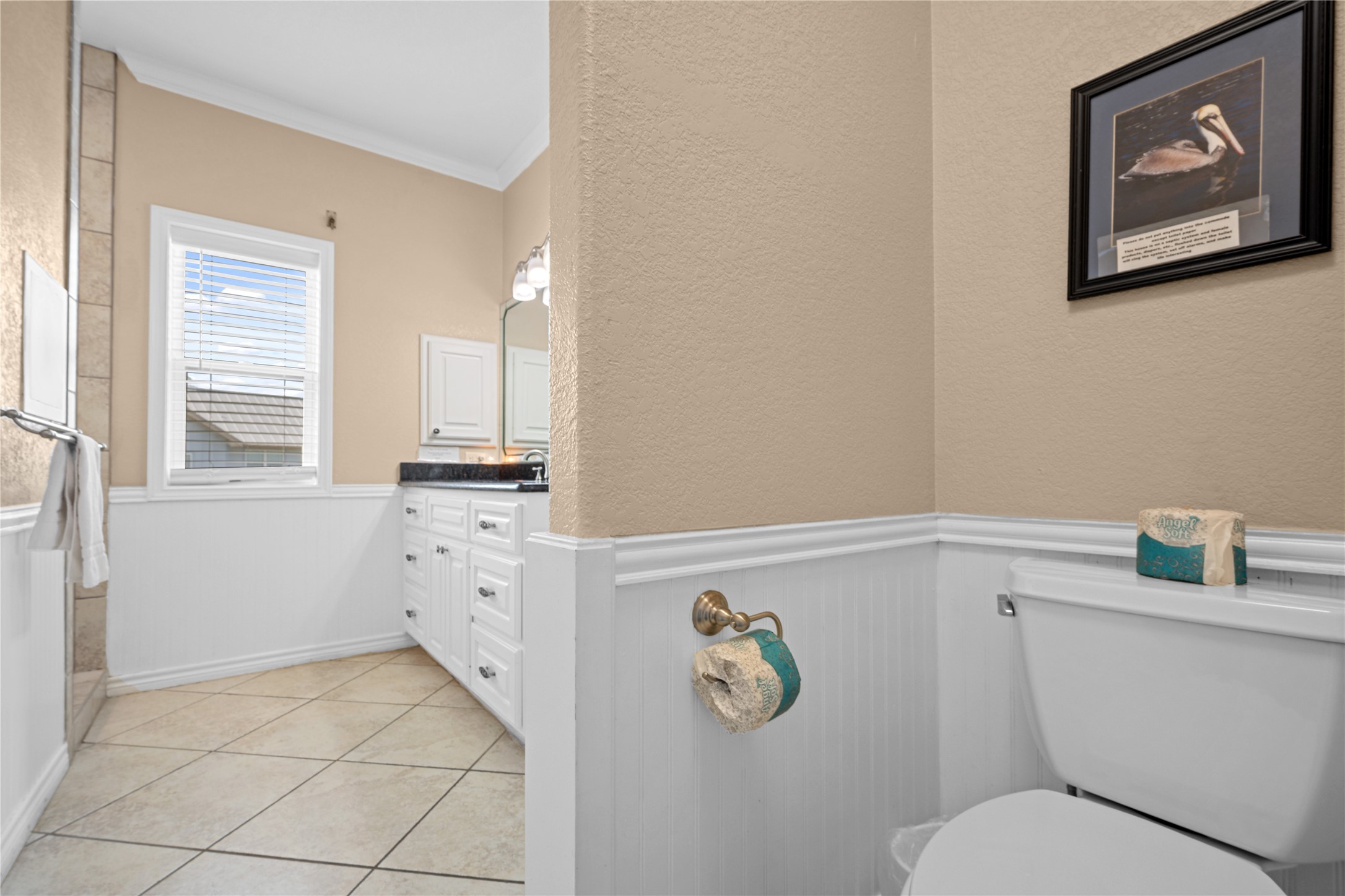 740 Copano Cove Road Rockport, TX 78382 - Photo 28 of 35 a bathroom with a granite countertop toilet and a sink
