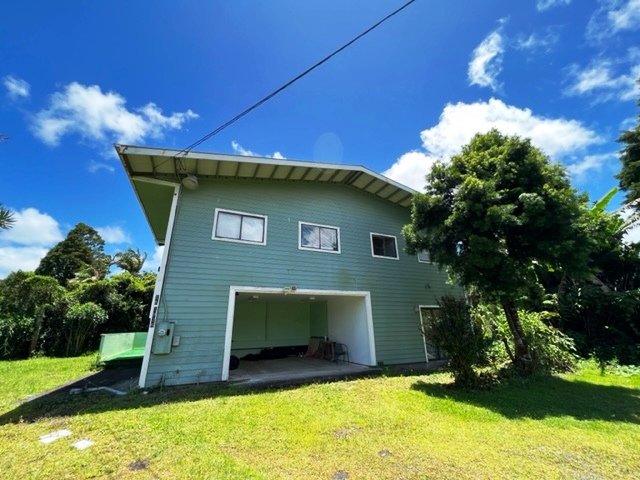 18-1976 Nau Nani Road Mountain View, HI 96771 - Photo 1 of 25 a front view of a house with a yard