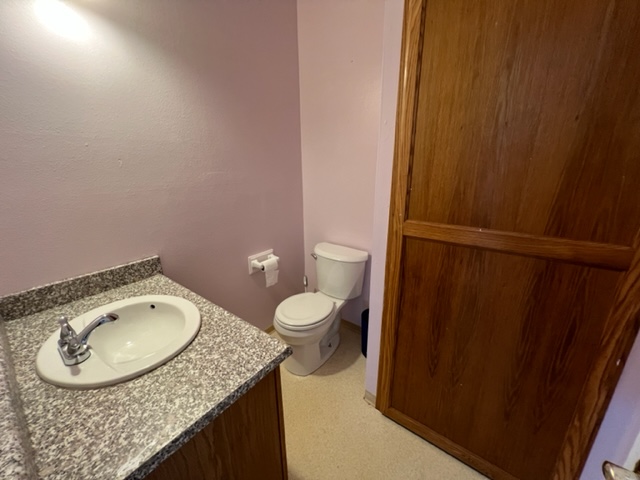 18-1976 Nau Nani Road Mountain View, HI 96771 - Photo 11 of 25 a bathroom with a granite countertop sink toilet and a mirror