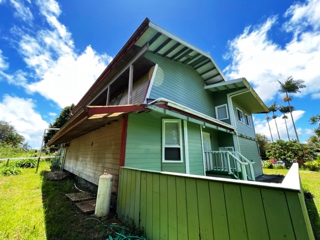 18-1976 Nau Nani Road Mountain View, HI 96771 - Photo 22 of 25 a backyard of a house with lots of green space