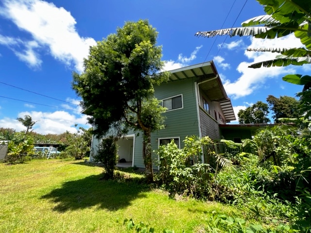 18-1976 Nau Nani Road Mountain View, HI 96771 - Photo 24 of 25 a front view of a house with garden