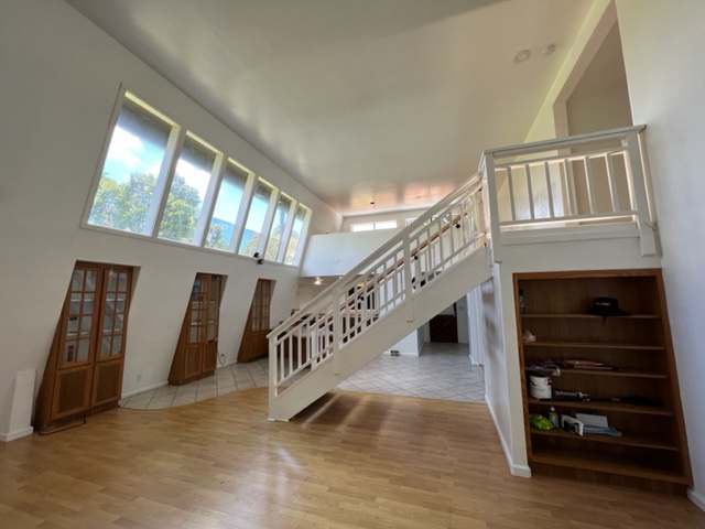 18-1976 Nau Nani Road Mountain View, HI 96771 - Photo 5 of 25 a view of staircase with white walls and a window