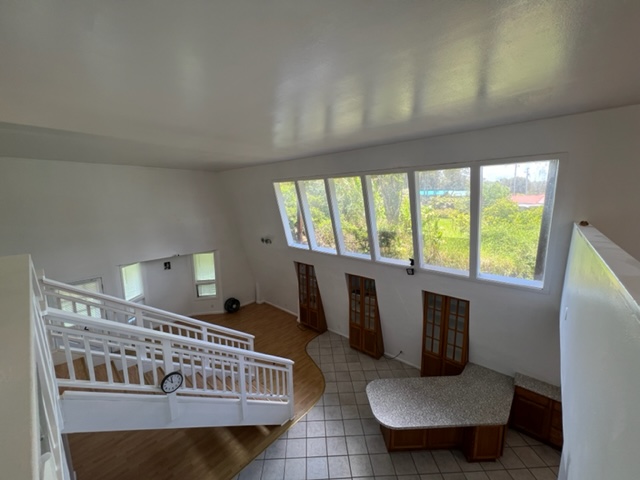 18-1976 Nau Nani Road Mountain View, HI 96771 - Photo 8 of 25 a living room with furniture and a large window