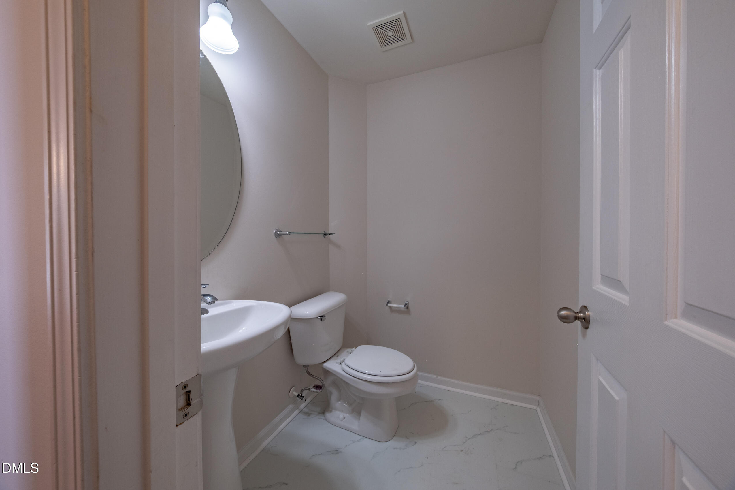 719 Obsidian Way Durham, NC 27703 - Photo 10 of 41 a white toilet sitting next to a shower