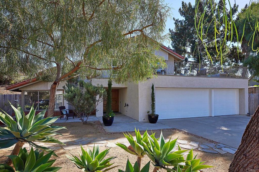 2107 Meadowgreen Court Encinitas, CA 92024 - Photo 2 of 49 a house with a flower garden in front of it