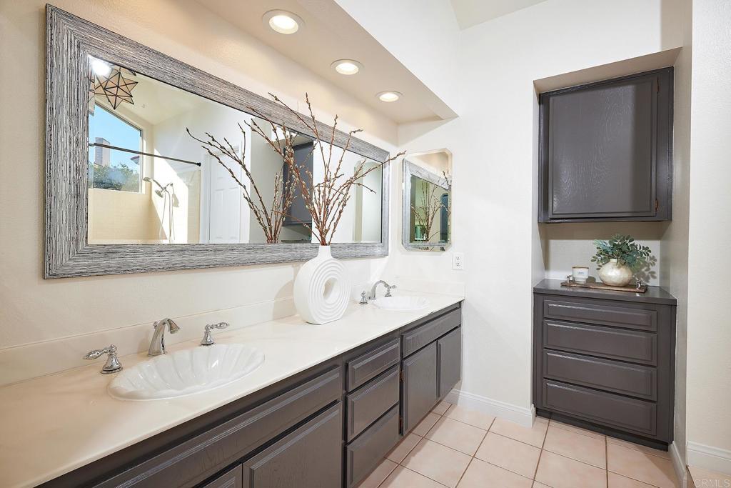 2107 Meadowgreen Court Encinitas, CA 92024 - Photo 22 of 49 a bathroom with a sink and a mirror