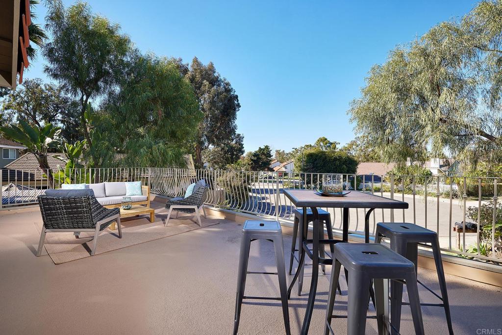 2107 Meadowgreen Court Encinitas, CA 92024 - Photo 28 of 49 a view of a patio with a table and chairs