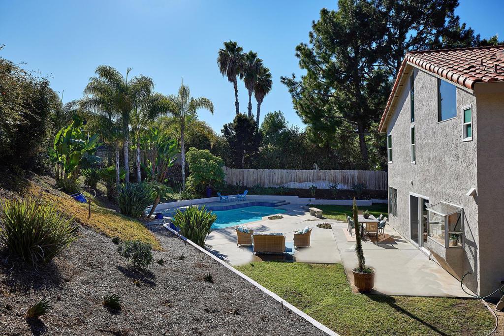 2107 Meadowgreen Court Encinitas, CA 92024 - Photo 3 of 49 a view of a backyard with sitting area and entertaining space