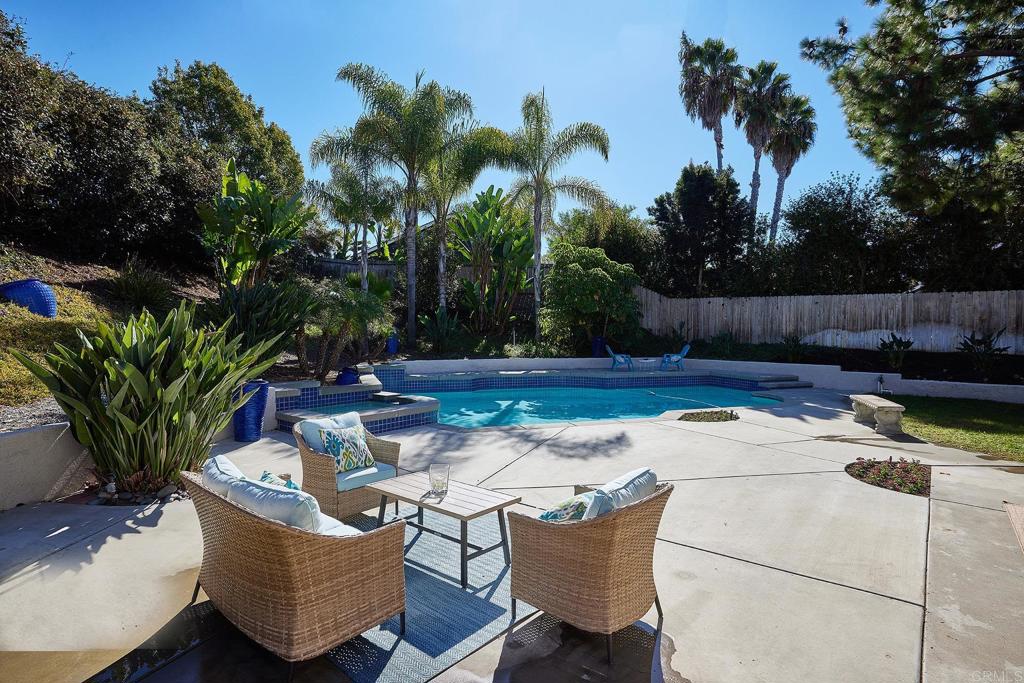 2107 Meadowgreen Court Encinitas, CA 92024 - Photo 31 of 49 a view of a backyard with swimming pool and sitting area