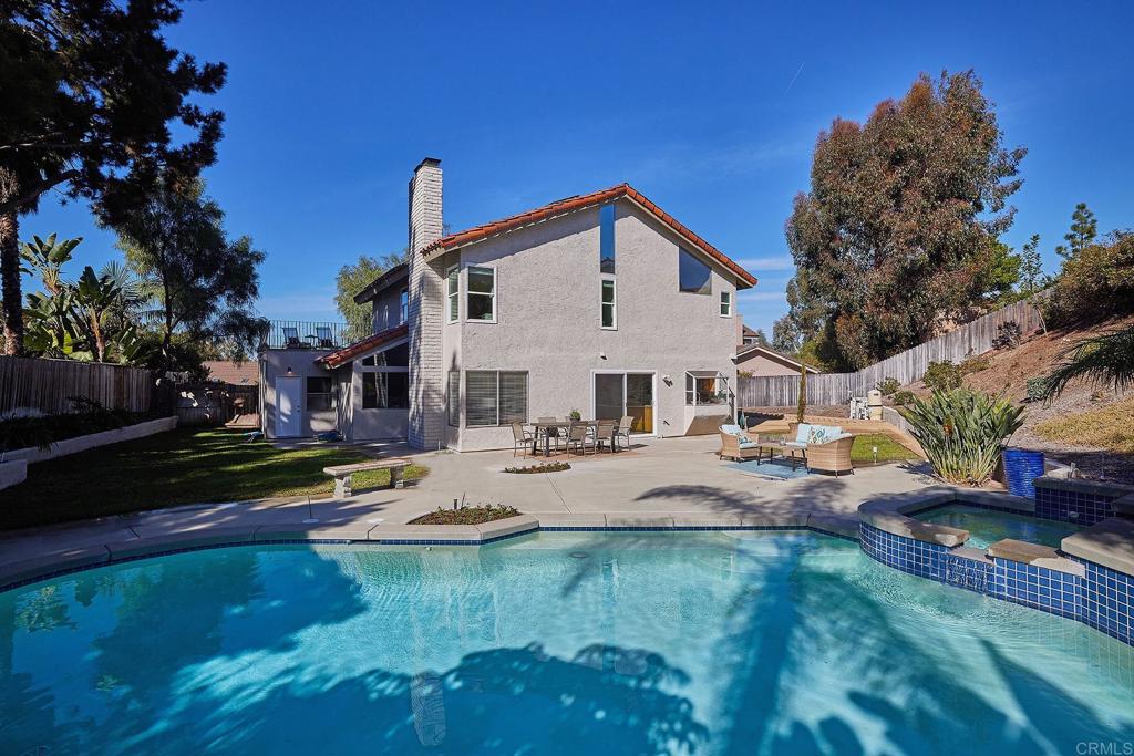 2107 Meadowgreen Court Encinitas, CA 92024 - Photo 38 of 49 a view of a house with pool and chairs