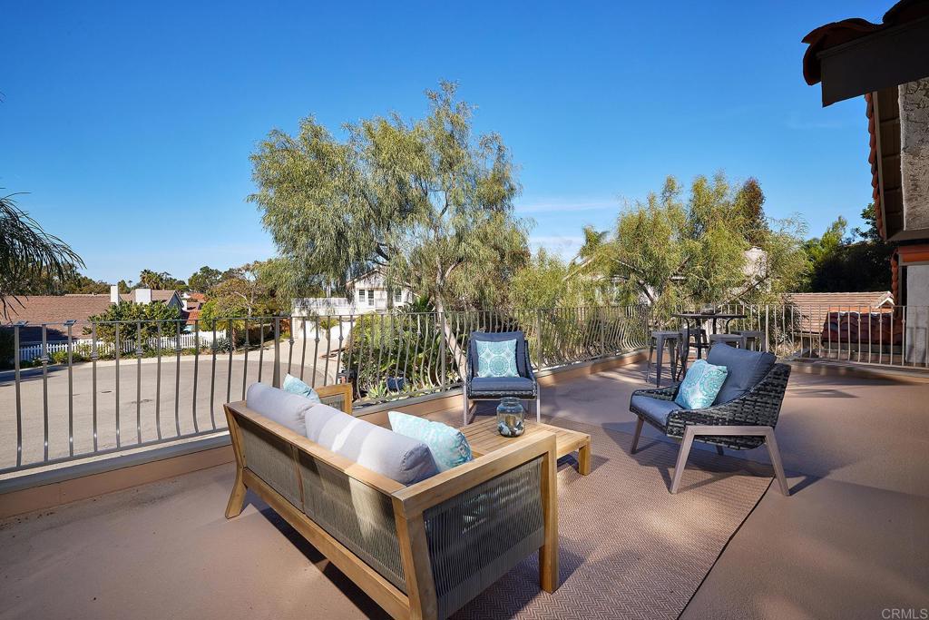 2107 Meadowgreen Court Encinitas, CA 92024 - Photo 4 of 49 a view of a patio with chairs and a flower pot