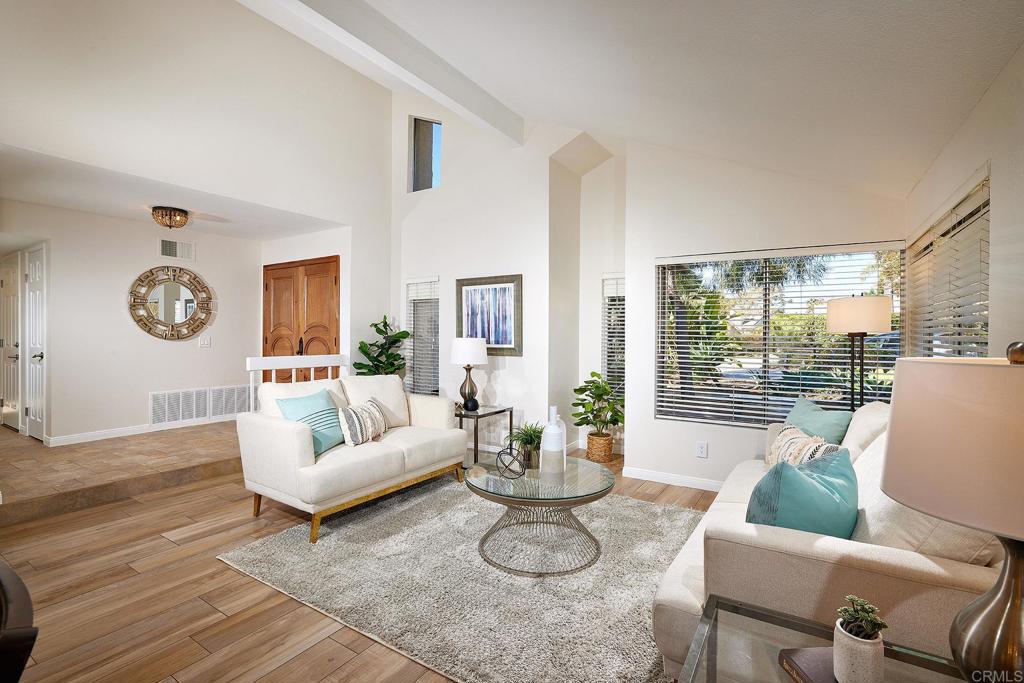 2107 Meadowgreen Court Encinitas, CA 92024 - Photo 8 of 49 a living room with furniture and a large window