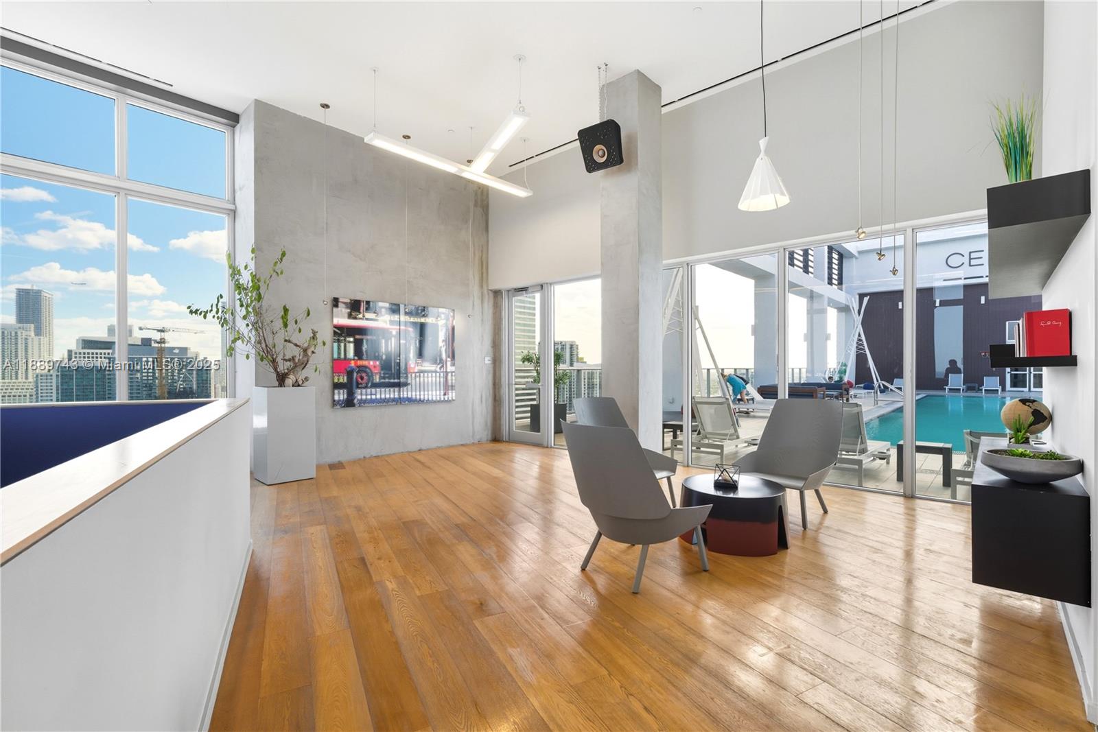 151 Southeast 1st Street, Unit 2002 Miami, FL 33131 - Photo 11 of 16 a living room with lots of furniture and white walls
