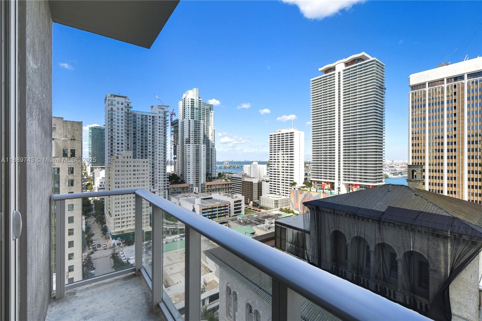 151 Southeast 1st Street, Unit 2002 Miami, FL 33131 - Photo 5 of 16 a kitchen with a sink and a refrigerator