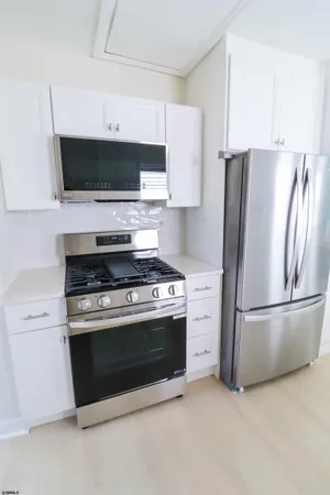 a kitchen with a stove and a microwave