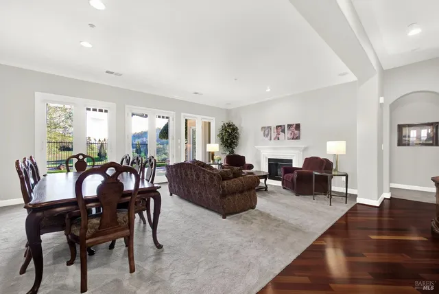 a living room with furniture and a lamp