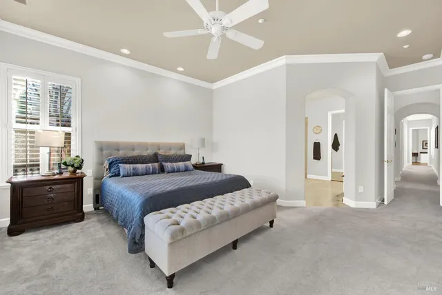 a bedroom with a bed and a television