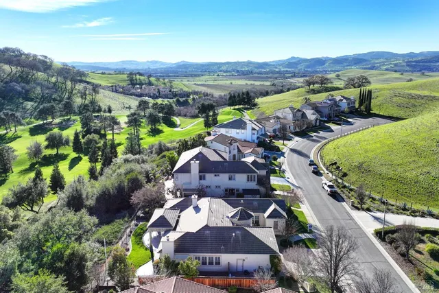 a view of a porch with furniture and garden