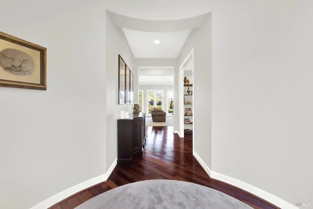 a dining room with furniture and wooden floor