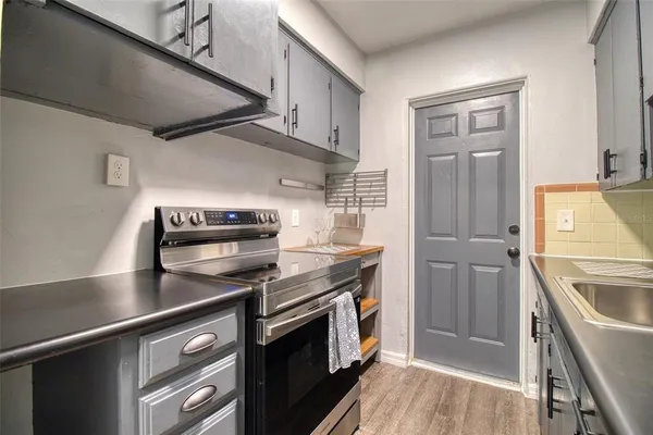 a kitchen with a stove and a refrigerator