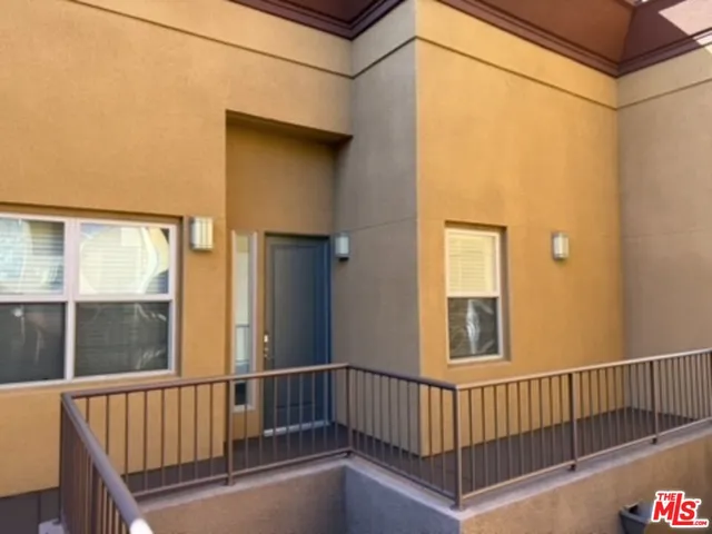 a view of a balcony with window