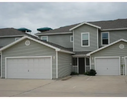a front view of a house with garage