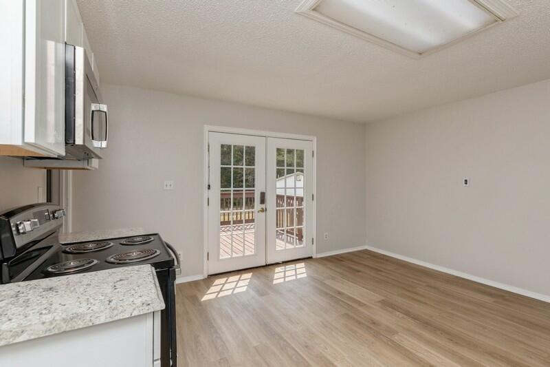 5867 Oak Hill Road Crestview, FL 32536 - Photo 15 of 33 a view of a kitchen with wooden floor and a sink
