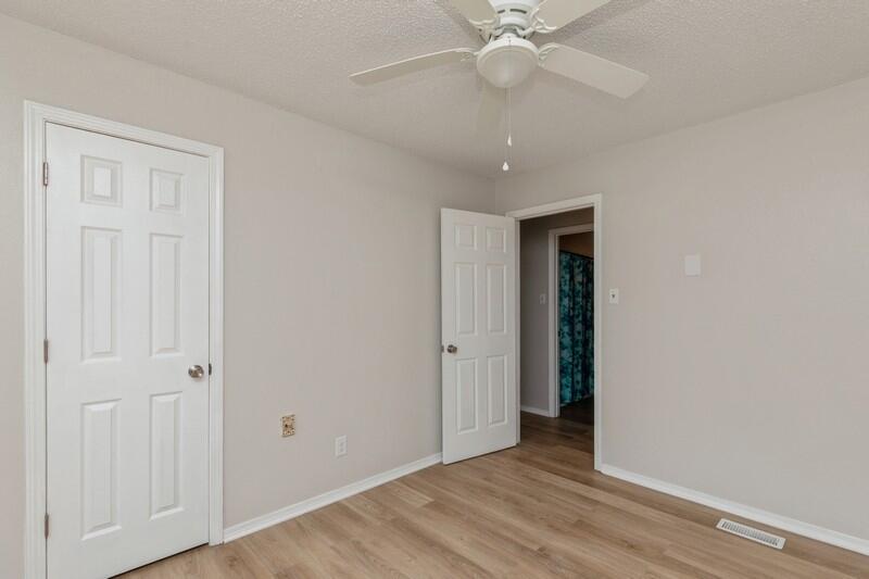 5867 Oak Hill Road Crestview, FL 32536 - Photo 17 of 33 a view of an empty room with wooden floor