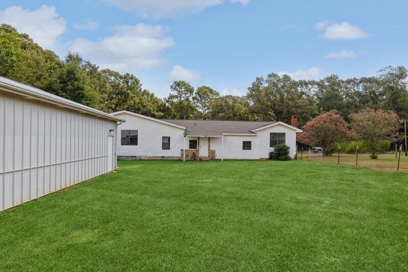 5867 Oak Hill Road Crestview, FL 32536 - Photo 2 of 33 a house view with a garden space